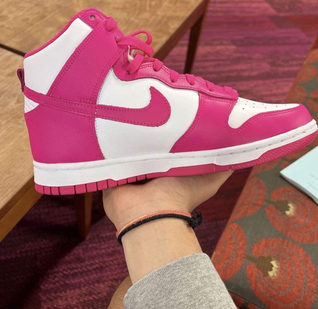 Nike Dunk High pair held for listing photos